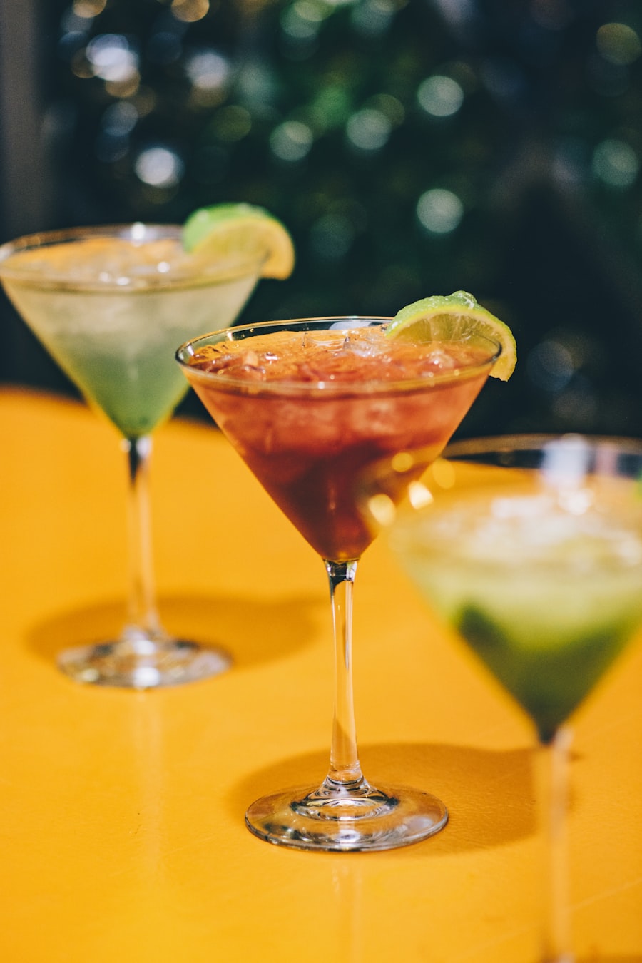 Three bright cocktails on a sunshine-yellow bar