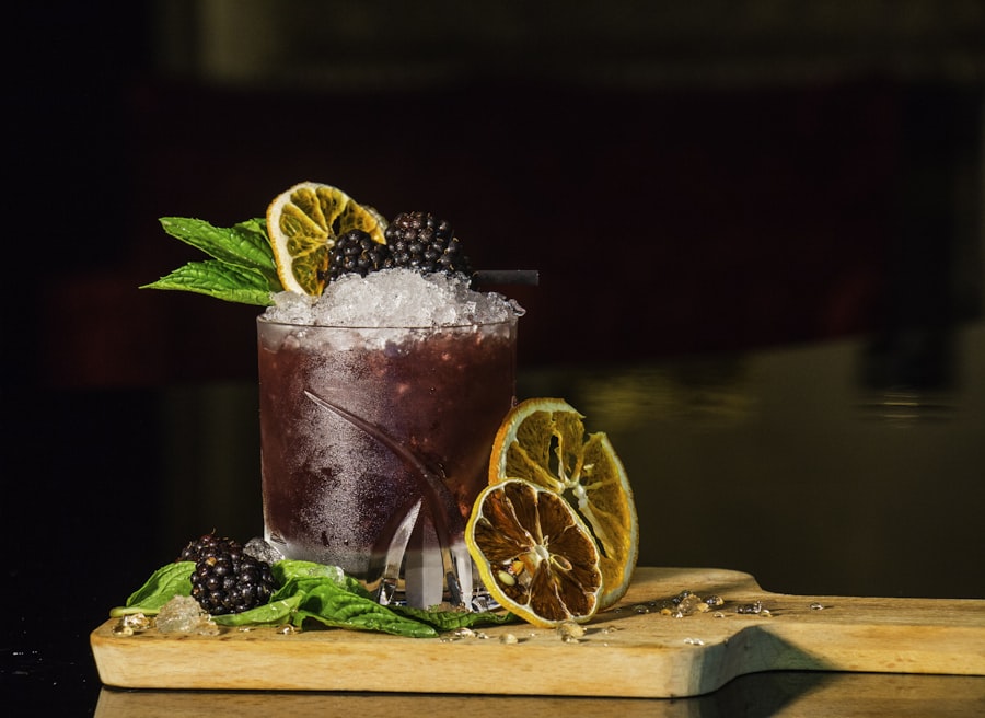 Blackberry cocktail with citrus garnish